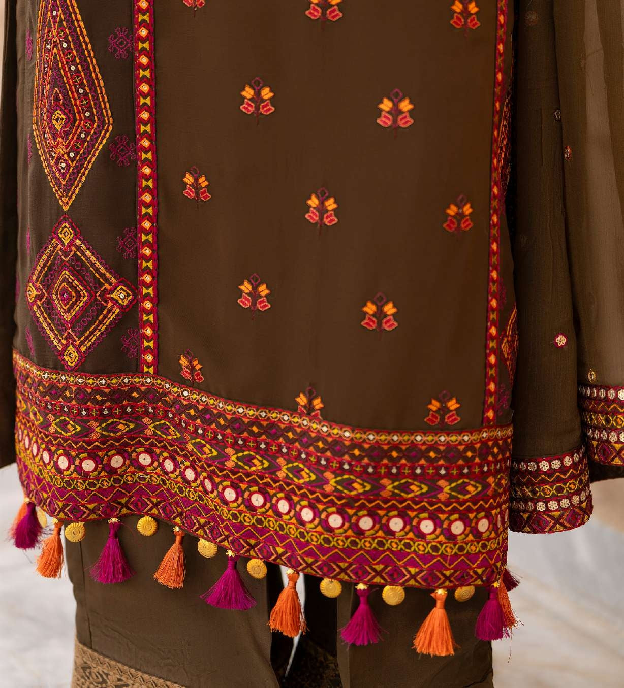 Luxury Olive Green Embroidered Designer Suit with Handcrafted Mirror Work & Tassel Accents